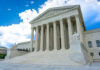 1 Million At Risk? Court Hands Trump Control White building with columns under a blue sky.