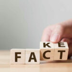 Fact and Fake written on wooden cube blocks.