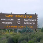 Camp Pendleton entrance sign in a desert landscape