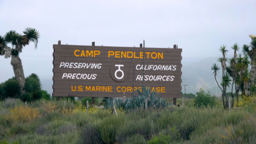 Camp Pendleton entrance sign in a desert landscape