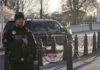 Secret Service agent standing near restricted area sign.