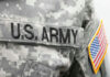 U.S. Army uniform with American flag patch.