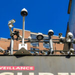 Profiling Scandal Erupts at Madison Square Garden Array of security cameras mounted above a building facade under a clear blue sky