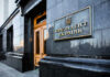 Unelected Energy Chief Seizes Ukraine Helm Exterior view of the Ukrainian presidential building with a sign
