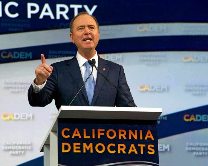 Man in suit speaking at a podium with microphones
