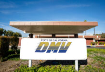 California DMV building with sign and greenery