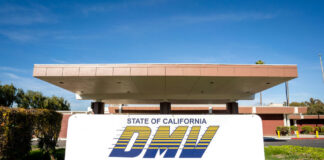 California DMV building with sign and greenery