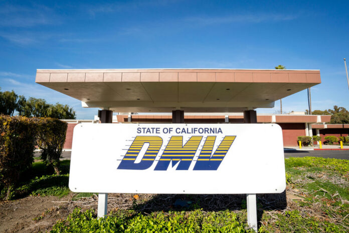 California DMV building with sign and greenery