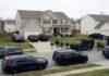FBI agents conducting an operation in a suburban neighborhood