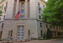 Secret Terror Court Finally Activates Stone government building with American flag at entrance